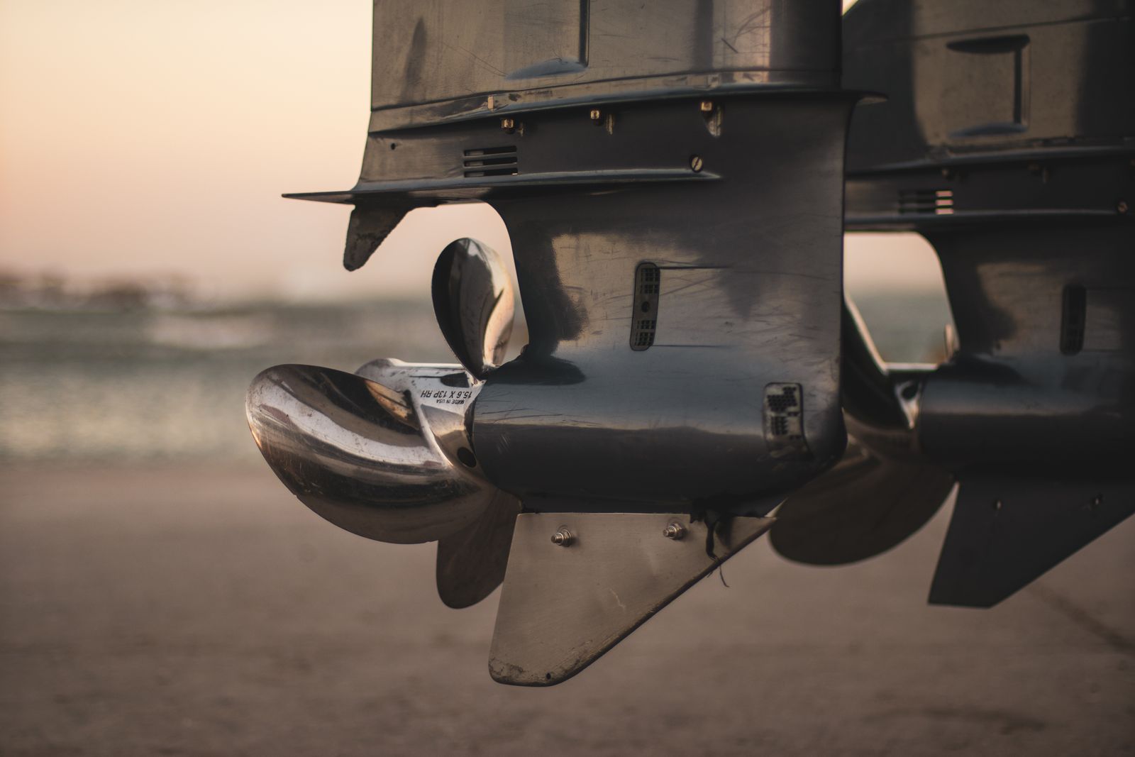 Close view of an outboard lower unit and propeller